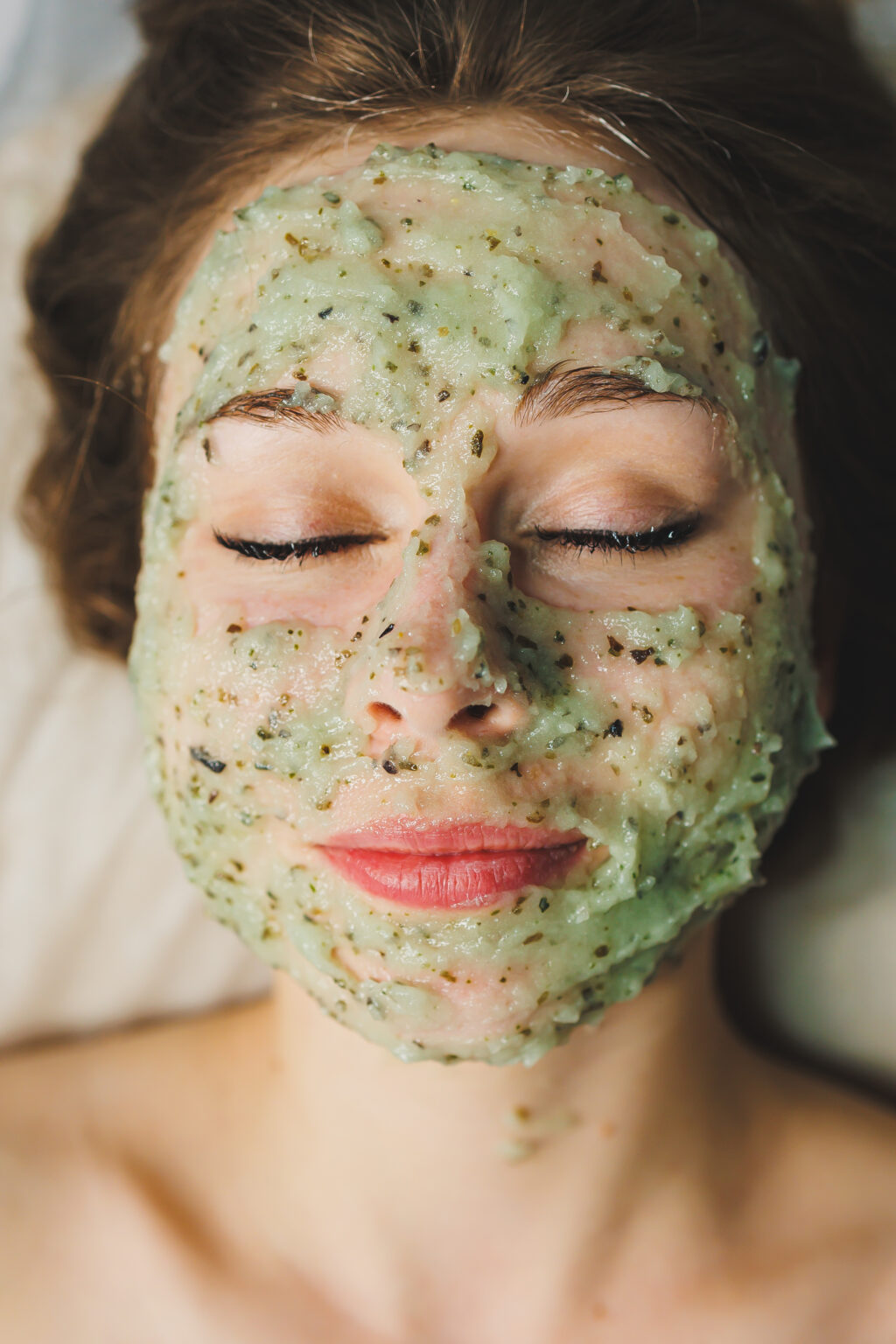 Facial skin care. A woman's face with an organic mask to moisturize the skin.
